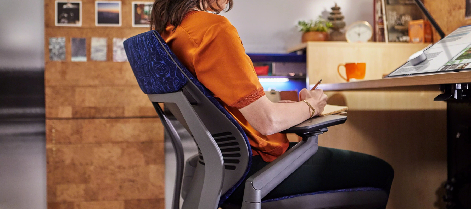 woman seated in a task chair with correct posture