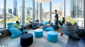 casual area with soft ottomans and bean bag chairs in different shades of blue