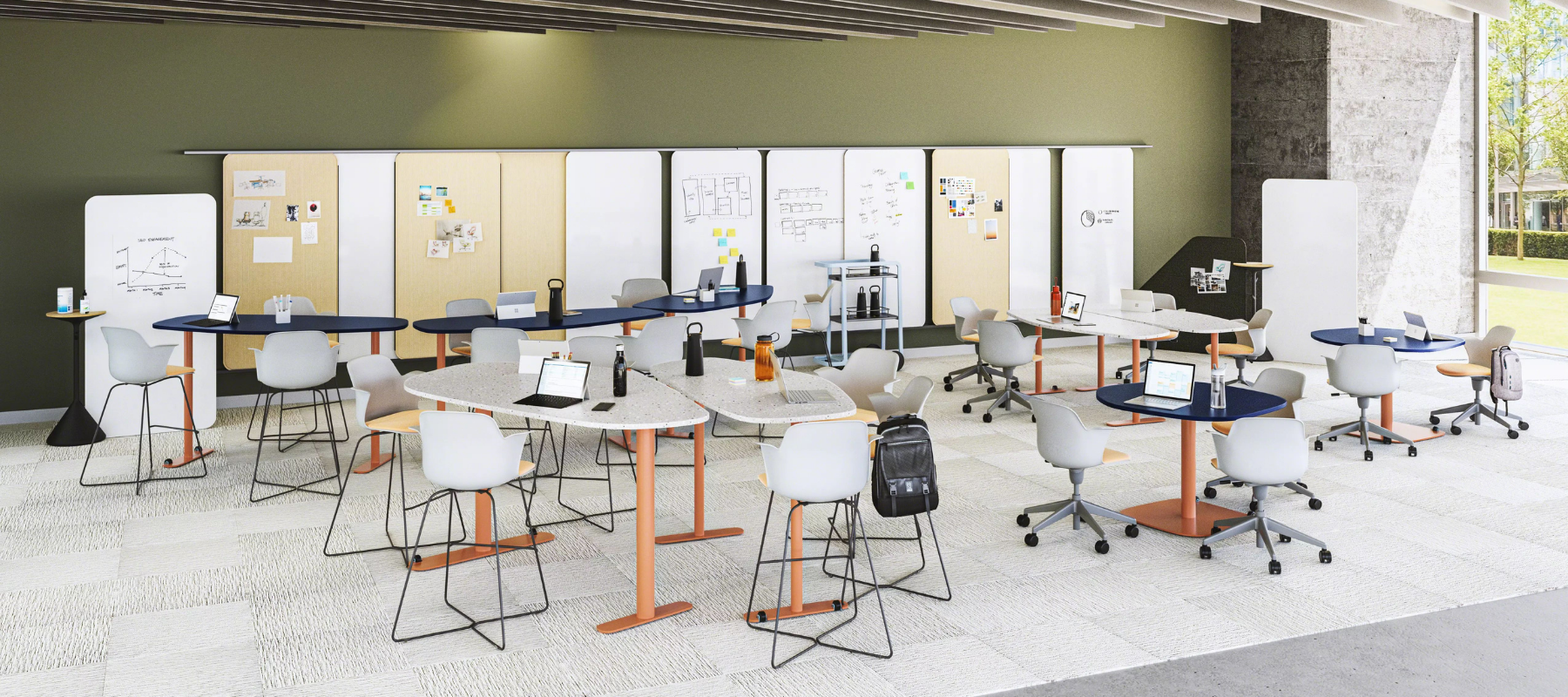 classroom with uniquely shaped tables with painted orange bases