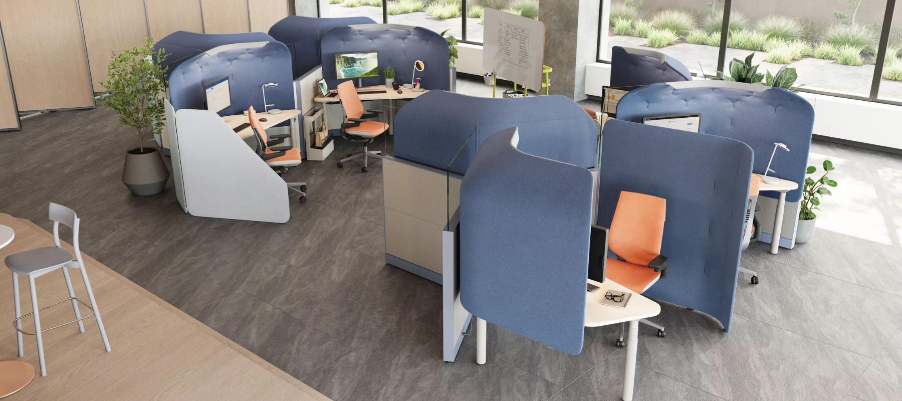 Workstations with acoustic panels wrapped around them for privacy and control